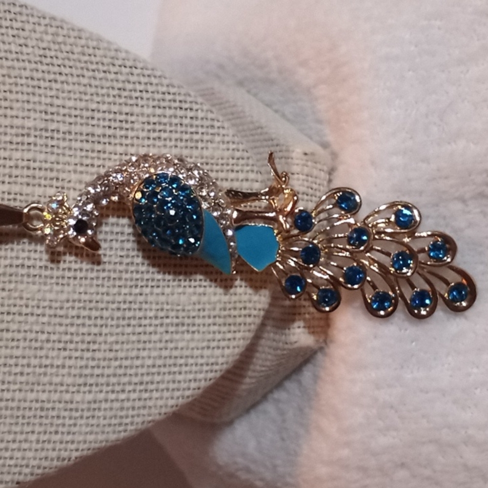 Betsy Johnson gold toned necklace, peacock